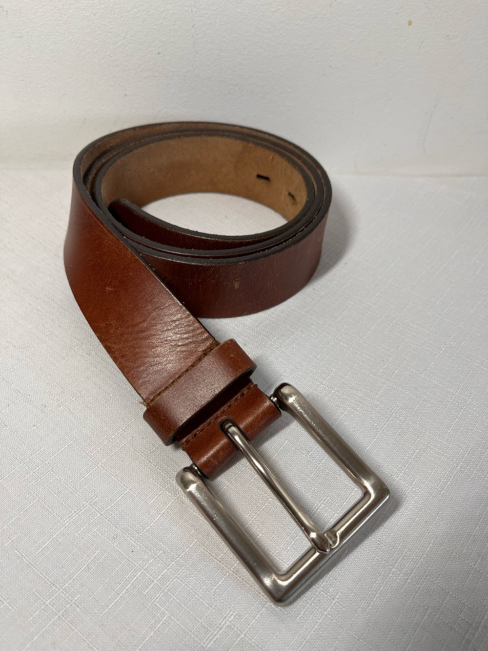Brown Leather Belt with Silver Buckle. Size 42. Made in India.